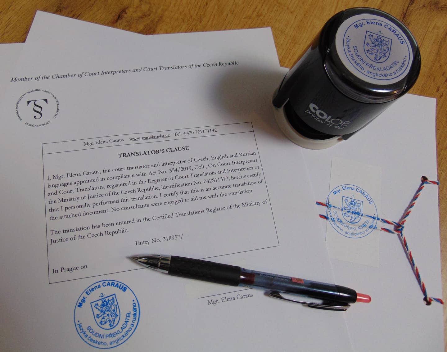 Certified translation with the translator's clause, round seal and stamp of court translator Mgr. Elena Caraus